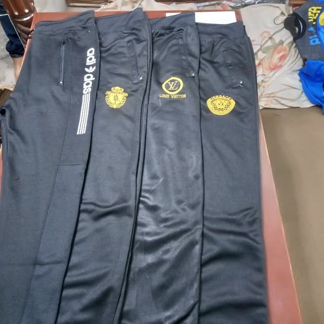 Black trouser with different logos